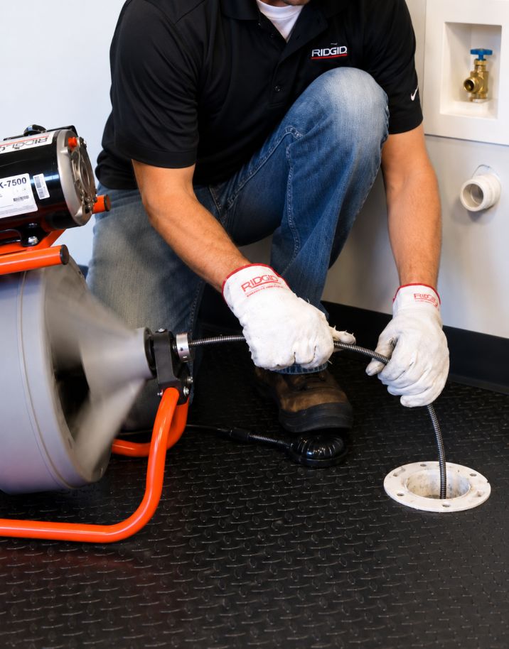 Licensed plumber repairing sink in Edmonton